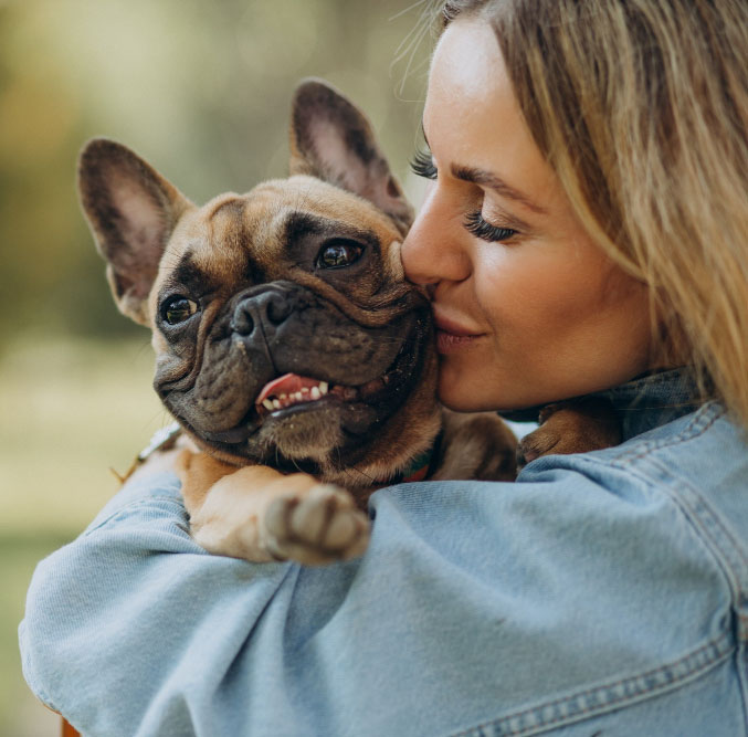 young woman holding her loved dog